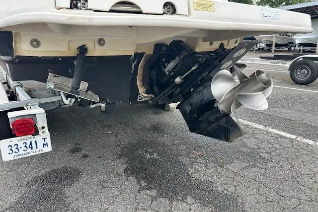 Slide: The Image of Rear view of a 2007 Sea Ray 260 Sundeck boat on a trailer, showing the propeller and outdrive. - 25