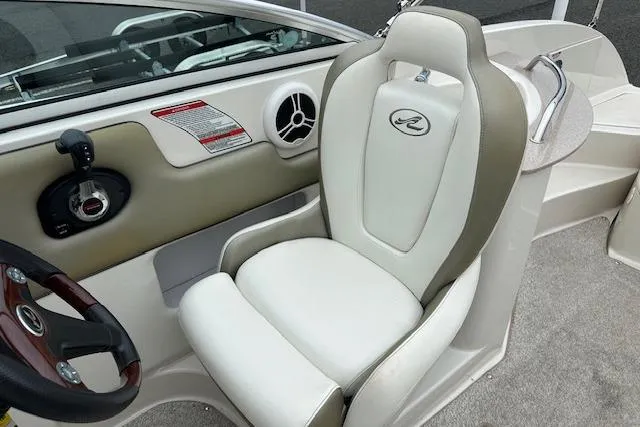 Slide: The Image of Captain's seat of a 2007 Sea Ray 260 Sundeck boat, featuring a sleek design. - 5