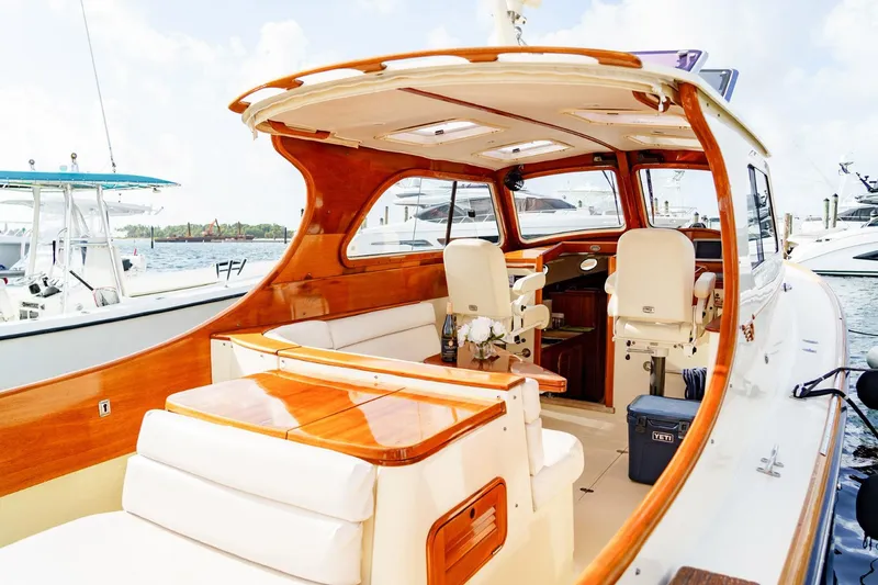 Slide: The Image of 2003 Hinckley Picnic Boat EP with elegant wooden interior docked at marina. - 15