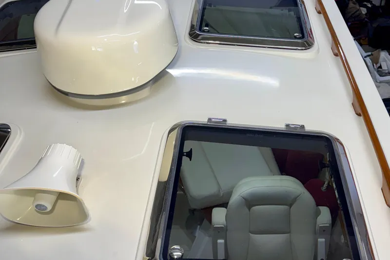 Slide: The Image of 2003 Hinckley Picnic Boat EP deck with hatch and seating visible. - 18
