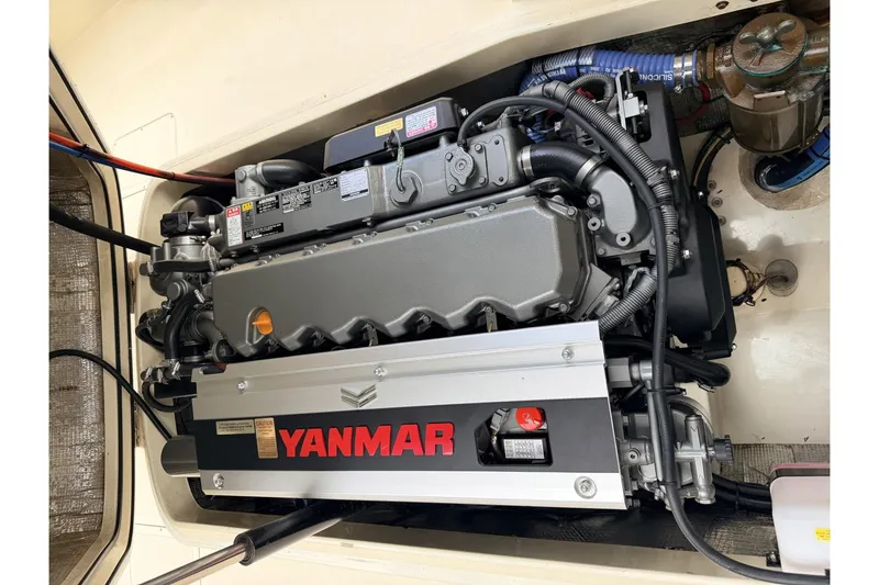 Slide: The Image of Engine of a 2003 Hinckley Picnic Boat EP featuring a Yanmar diesel engine. - 2