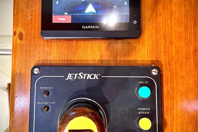 Slide: The Image of Control panel of a 2003 Hinckley Picnic Boat EP with Garmin display and JetStick system. - 8