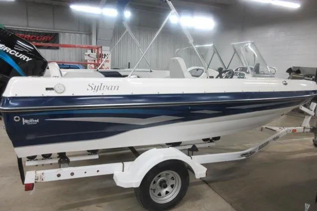 Slide: The Image of 2003 Sylvan V180 Viper OB boat on trailer in indoor showroom. - 3