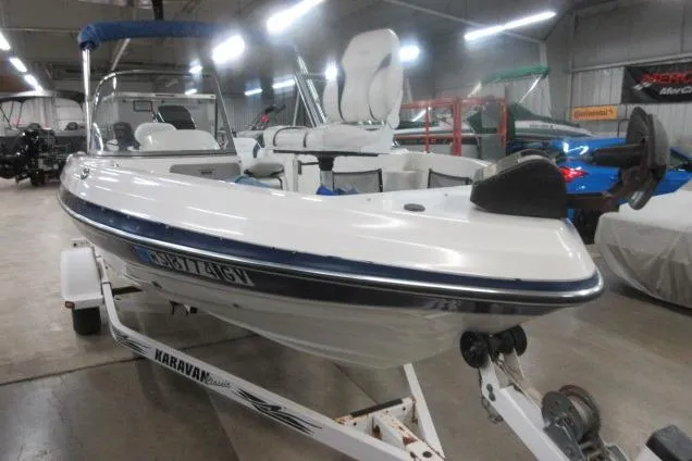 Slide: The Image of 2003 Sylvan V180 Viper OB boat on Karavan trailer in indoor showroom. - 4