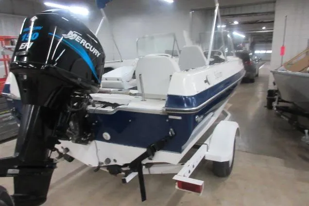 Slide: The Image of 2003 Sylvan V180 Viper OB boat with Mercury engine in a garage setting. - 8