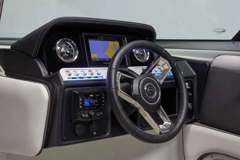 Slide: The Image of 2024 Crownline Eclipse E235 SURF dashboard with modern steering wheel and digital display. - 12