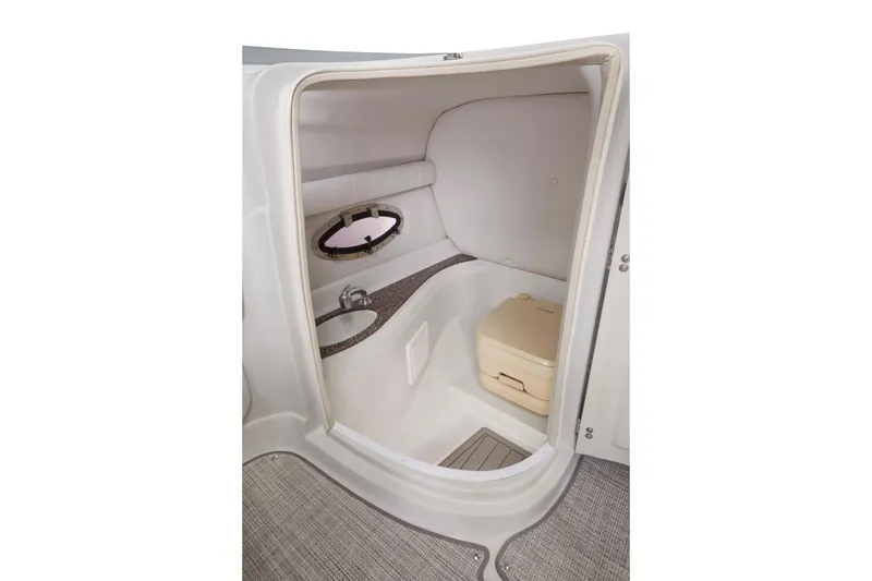 Slide: The Image of 2024 Crownline Eclipse E235 SURF boat interior with compact bathroom and sink. - 13