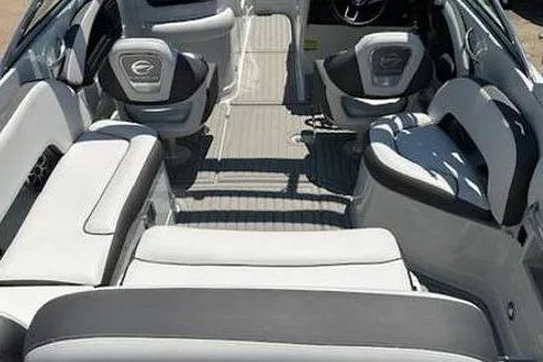 Slide: The Image of 2024 Crownline Eclipse E235 SURF boat interior with luxurious seating and modern design. - 4