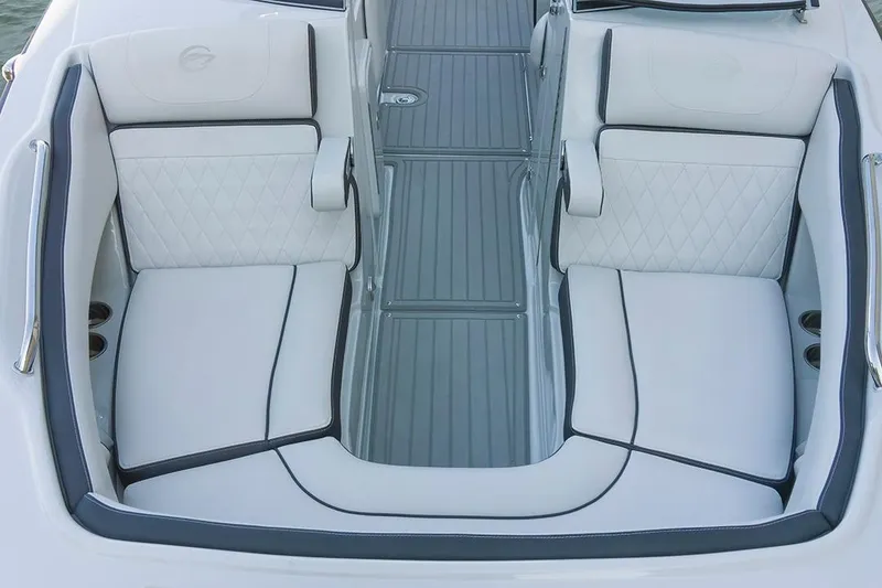 Slide: The Image of 2024 Crownline Eclipse E235 SURF boat interior with luxurious white seating. - 6