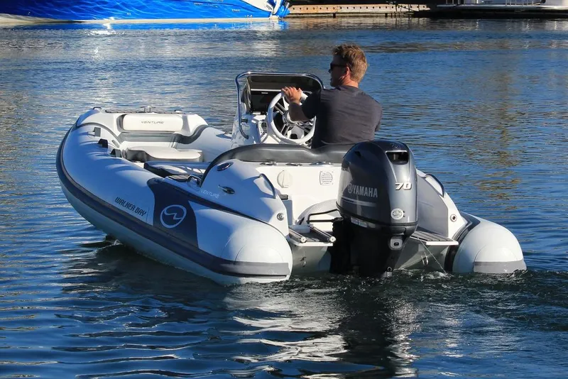 Slide: The Image of Manufacturer Provided Image: 2022 Walker Bay Venture 14 boat with Yamaha engine on water. - 4