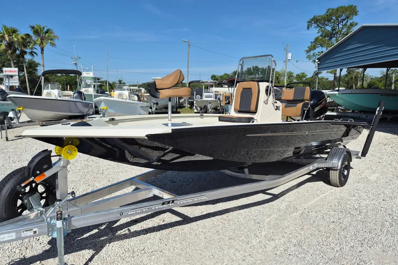 The Image of 2026 Xpress H20B Bay boat on trailer in outdoor dealership lot. - 0