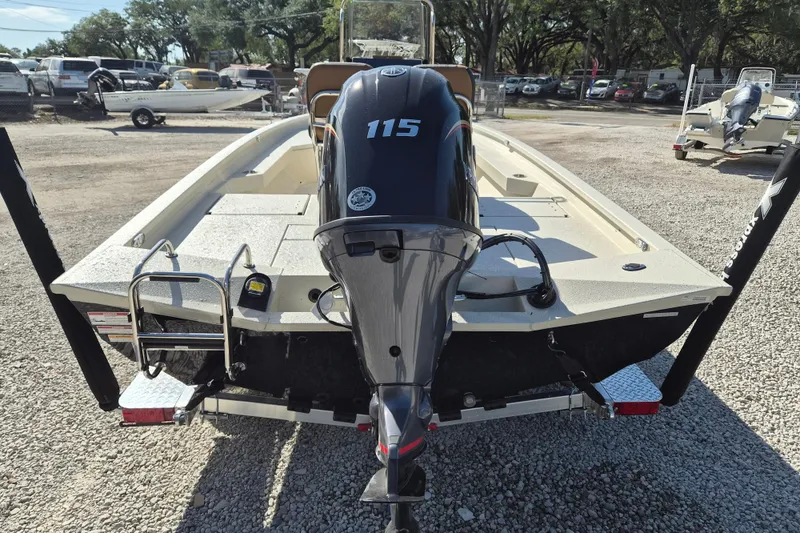 Slide: The Image of 2026 Xpress H20B Bay boat with 115 horsepower engine in a parking lot. - 5