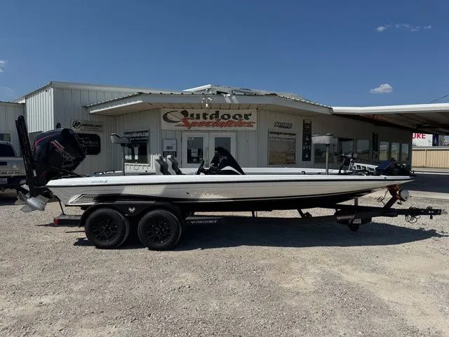 The Image of 2026 Phoenix 921 Elite X boat parked outside Outdoor Specialties store. - 1