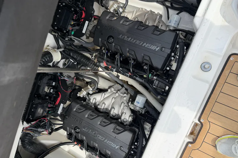 Slide: The Image of Engine compartment of a 2022 Yamaha Boats 252SE, showcasing dual high-output engines. - 12
