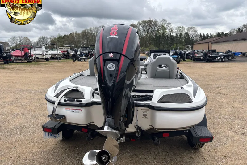 Slide: The Image of 2024 Nitro Z18 boat with powerful outboard motor in a dealership lot. - 3