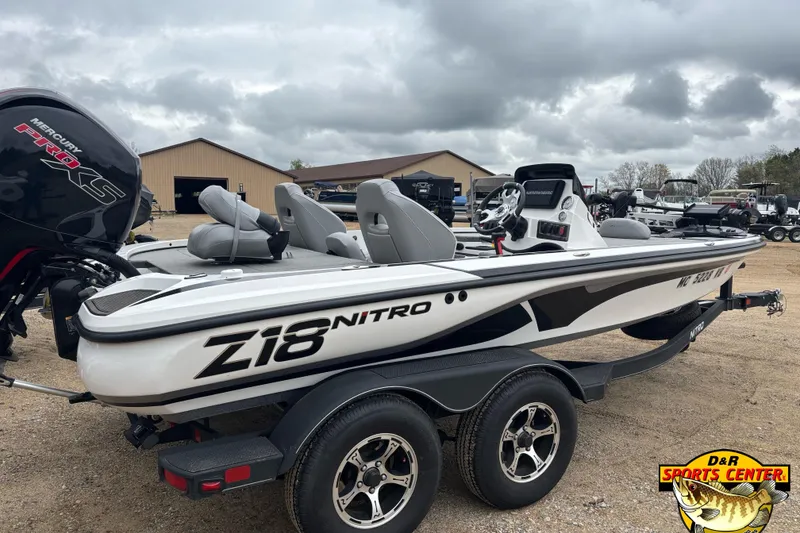 Slide: The Image of 2024 Nitro Z18 boat with Mercury Pro XS engine, parked outdoors on a trailer. - 4