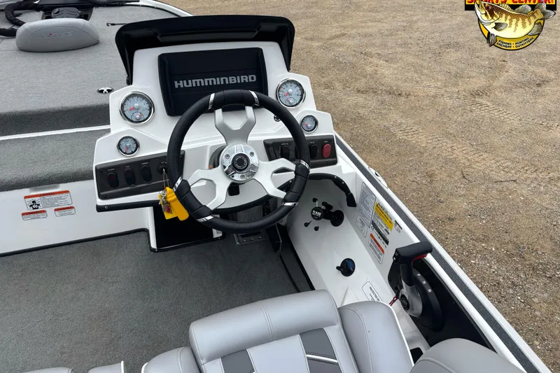 Slide: The Image of 2024 Nitro Z18 boat dashboard with steering wheel and Humminbird display. - 6