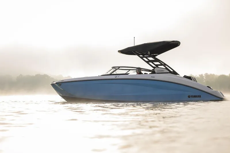 Slide: The Image of Manufacturer Provided Image: 2026 Yamaha Boats 252SD on calm water, sleek design, misty background. - 14