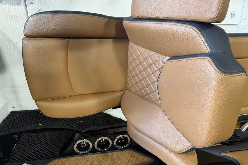 Slide: The Image of Luxurious tan leather seating in 2026 Yamaha Boats 252SD, featuring quilted design and black accents. - 6