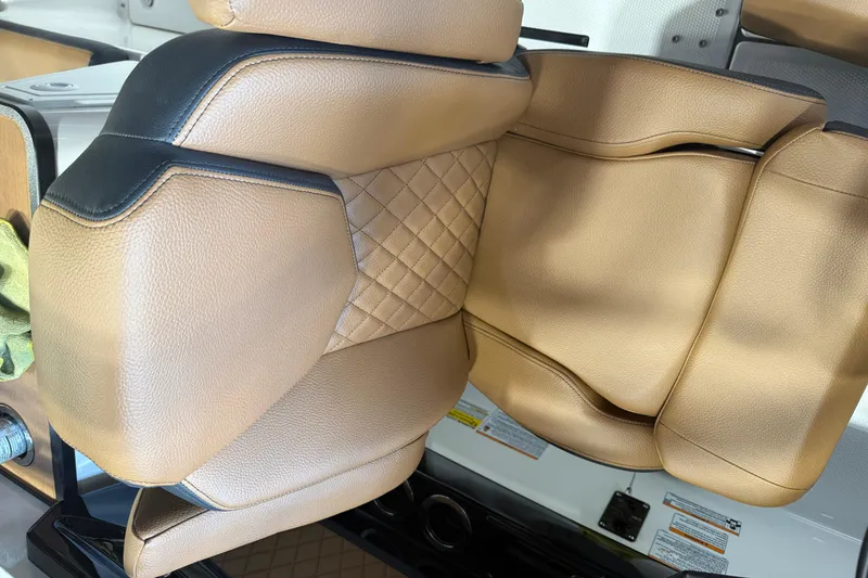 Slide: The Image of Luxurious tan leather seating in 2026 Yamaha Boats 252SD, featuring quilted design. - 7