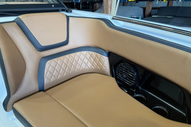 Slide: The Image of 2026 Yamaha Boats 252SD interior with tan leather seating and speaker system. - 8