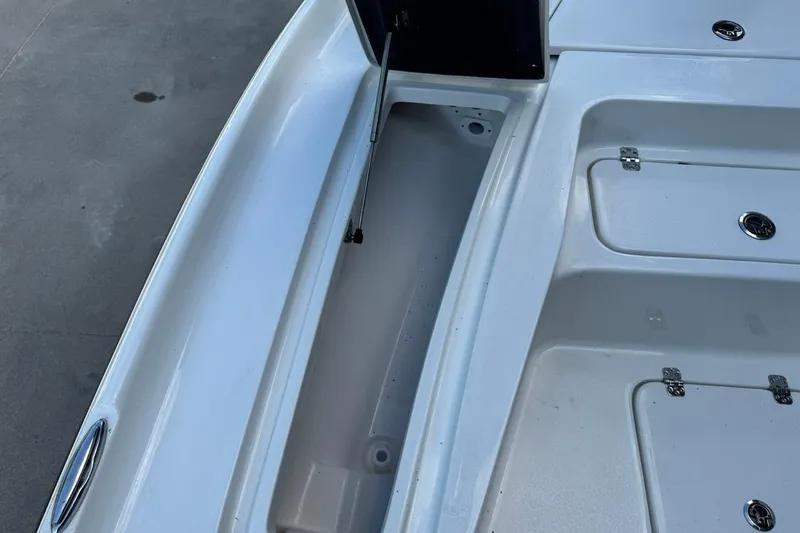 Slide: The Image of 2026 Key West 230 Bay Reef boat storage compartments and deck details. - 17