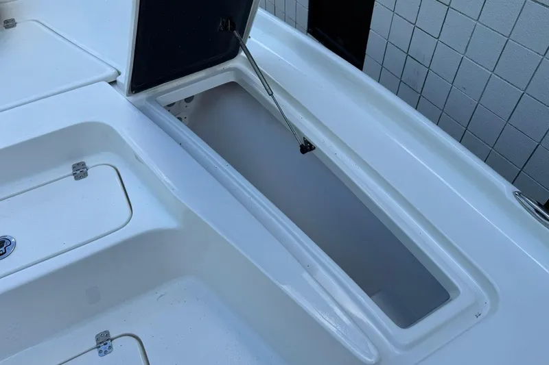 Slide: The Image of Open storage compartment on a 2026 Key West 230 Bay Reef boat. - 20