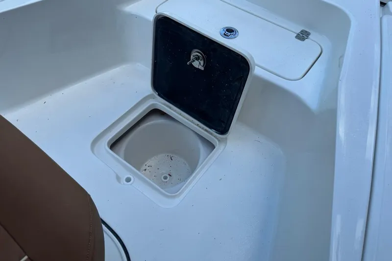 Slide: The Image of Key West 230 Bay Reef 2026 boat storage compartment with open hatch. - 21