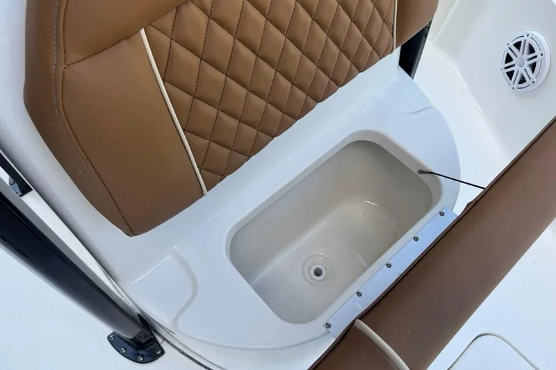 Slide: The Image of Brown cushioned seat and storage compartment on 2026 Key West 230 Bay Reef boat. - 22