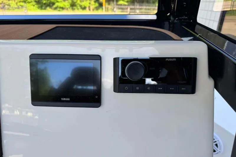 Slide: The Image of Control panel of 2026 Key West 230 Bay Reef with Yamaha and Fusion displays. - 29