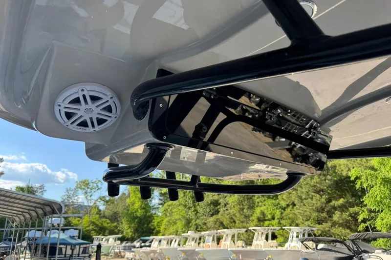 Slide: The Image of 2026 Key West 230 Bay Reef boat with speaker and equipment, docked outdoors. - 36