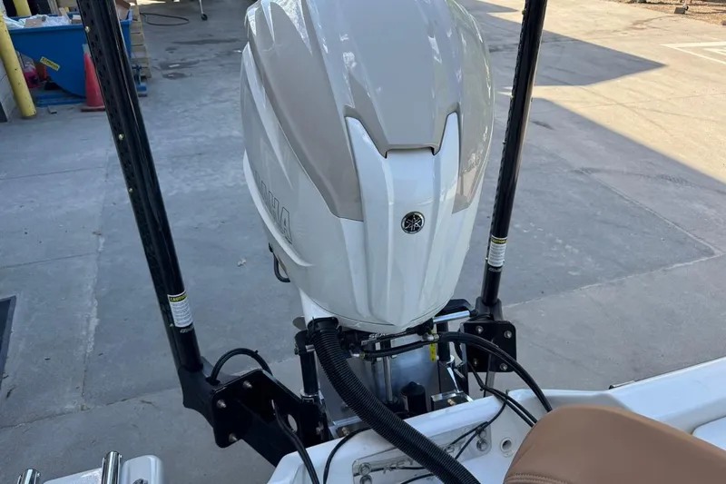 Slide: The Image of 2026 Key West 230 Bay Reef boat with Yamaha outboard motor in a marina setting. - 38