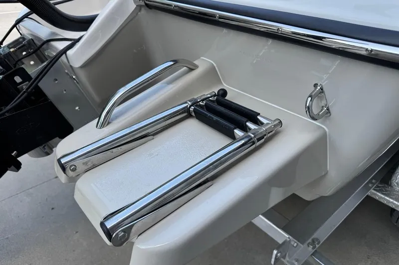 Slide: The Image of 2026 Key West 230 Bay Reef boat ladder and platform detail. - 6