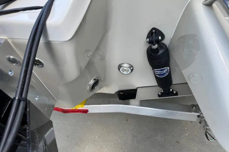 Slide: The Image of 2026 Key West 230 Bay Reef boat transom with Bennett trim tab actuator. - 7