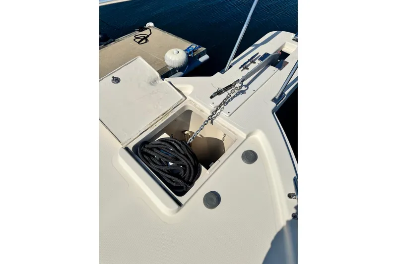 Slide: The Image of 2004 Mainship Pilot 30-II boat anchor locker with chain and rope storage. - 10