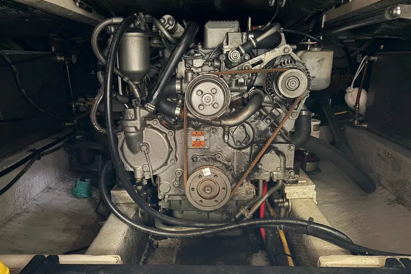 Slide: The Image of Engine compartment of a 2004 Mainship Pilot 30-II boat, showcasing mechanical components. - 36