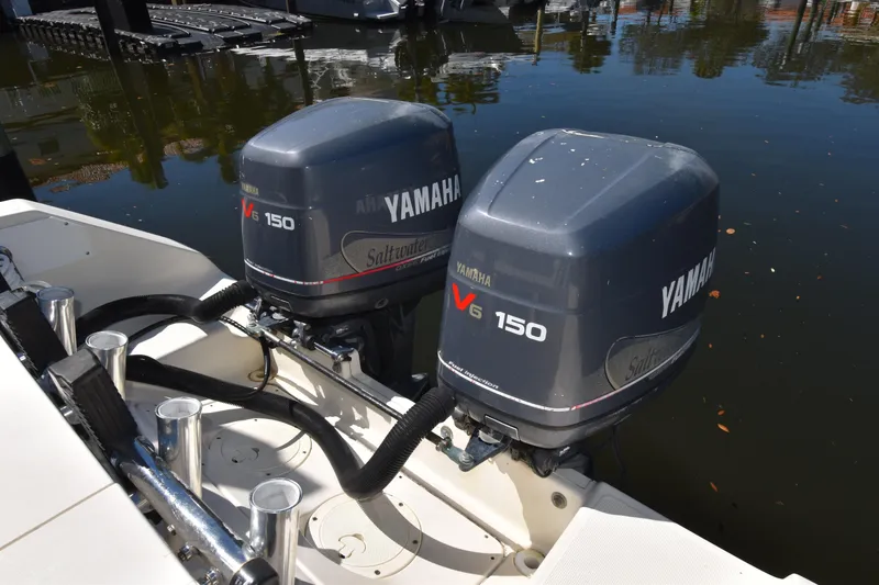 Slide: The Image of Twin Yamaha V6 150 outboard engines on a 2001 Pursuit 2470 Center Console boat. - 17