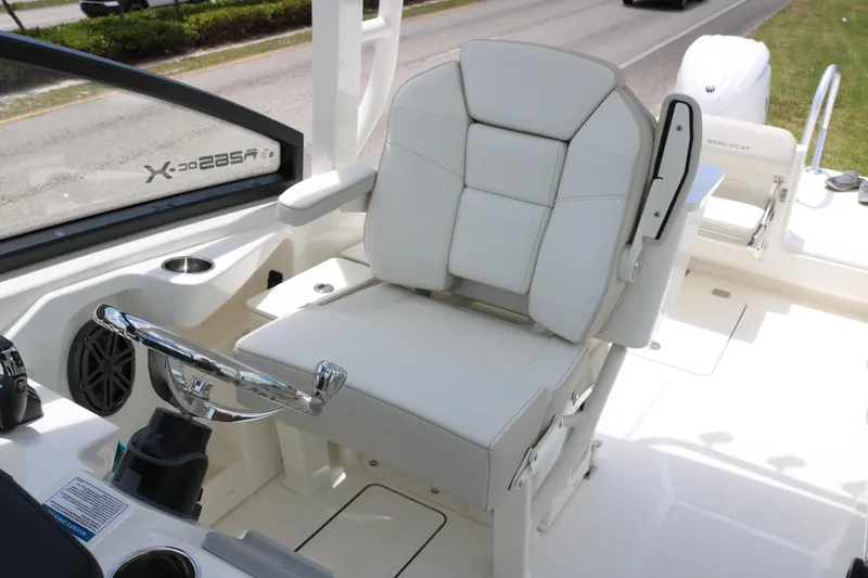 Slide: The Image of Luxury helm seat on 2026 World Cat 265 DC-X boat, featuring sleek design and comfort. - 10