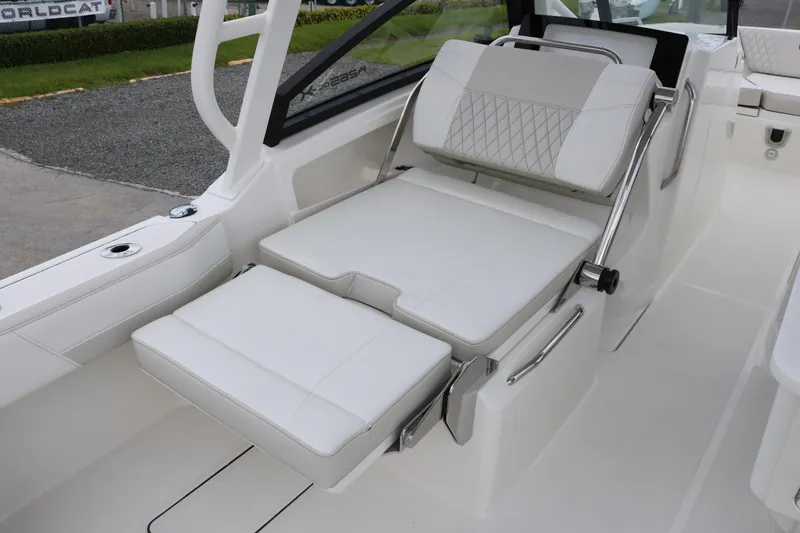 Slide: The Image of 2026 World Cat 265 DC-X boat interior with adjustable white seating. - 12