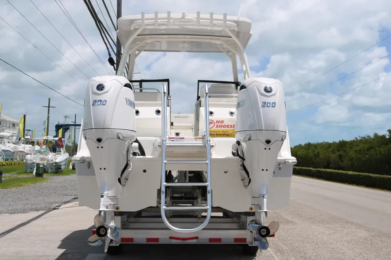 Slide: The Image of 2026 World Cat 265 DC-X boat with twin Yamaha engines, parked on a trailer. - 5