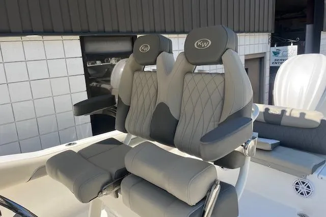 Slide: The Image of 2026 Key West 239 FS boat seats with gray upholstery and KW logo. - 10