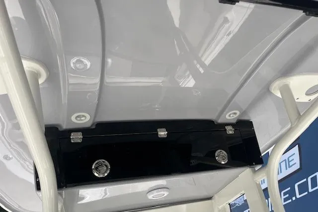 Slide: The Image of 2026 Key West 239 FS boat interior with storage compartment and sleek design. - 12