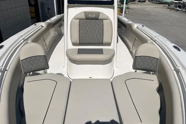 Slide: The Image of 2026 Key West 239 FS boat interior with cushioned seating and sleek design. - 16