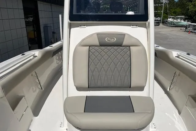 Slide: The Image of 2026 Key West 239 FS boat interior with cushioned seating and sleek design. - 17