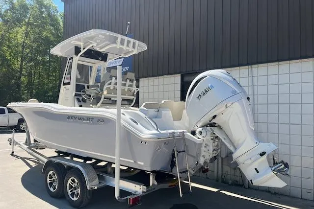 Slide: The Image of 2026 Key West 239 FS boat on trailer with Yamaha engine, parked outdoors. - 2