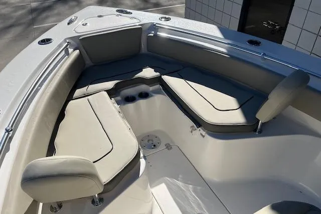 Slide: The Image of 2026 Key West 239 FS boat interior with cushioned seating and cup holders. - 20