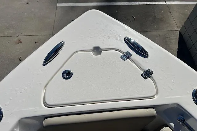 Slide: The Image of Bow of 2026 Key West 239 FS boat with storage hatch and cleats. - 22
