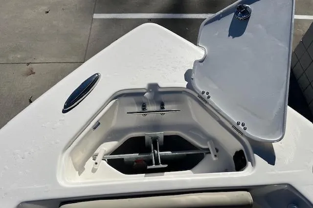 Slide: The Image of Open anchor compartment on 2026 Key West 239 FS boat, showcasing storage space. - 23