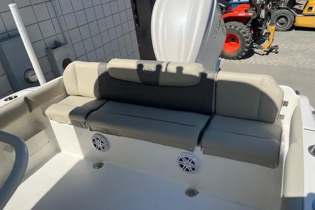 Slide: The Image of 2026 Key West 239 FS boat interior with cushioned seating and built-in speakers. - 7