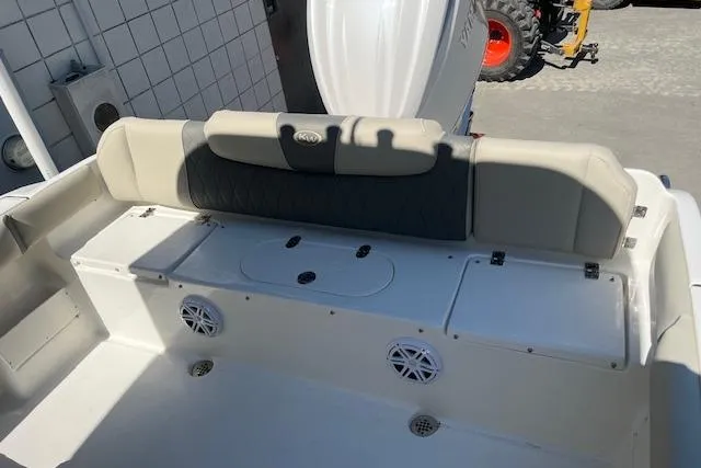 Slide: The Image of 2026 Key West 239 FS boat interior with cushioned seating and storage compartments. - 8
